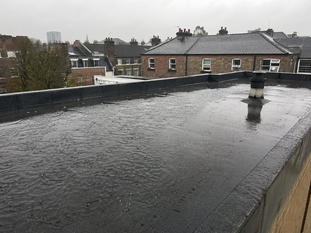 Emergency flat roof leak during heavy rain
